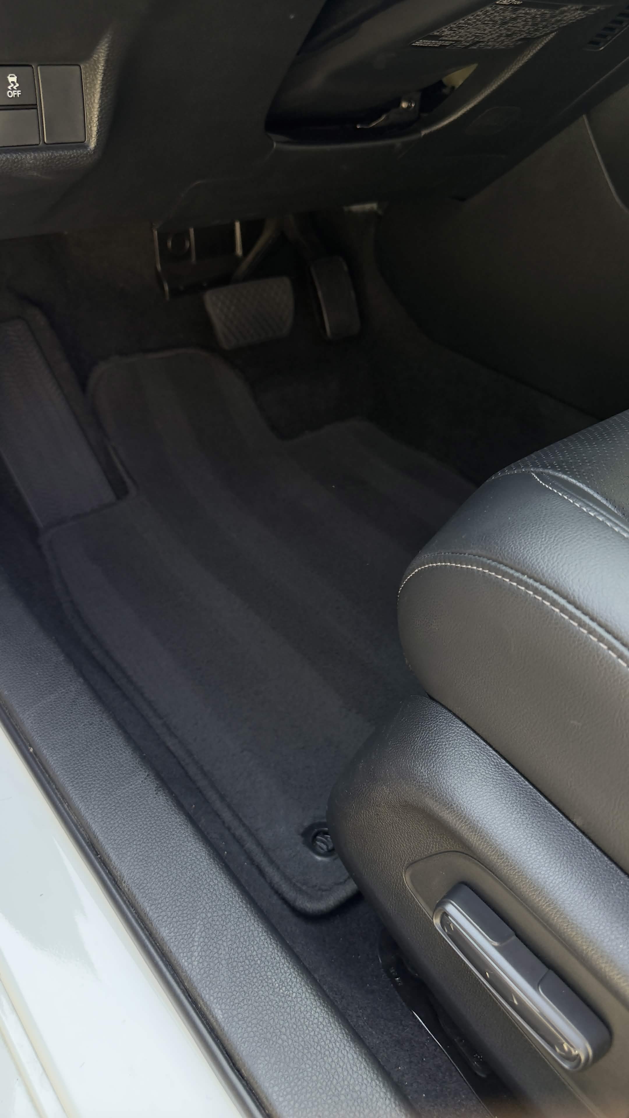 Sedan floor after interior detail — clean, vacuumed carpet