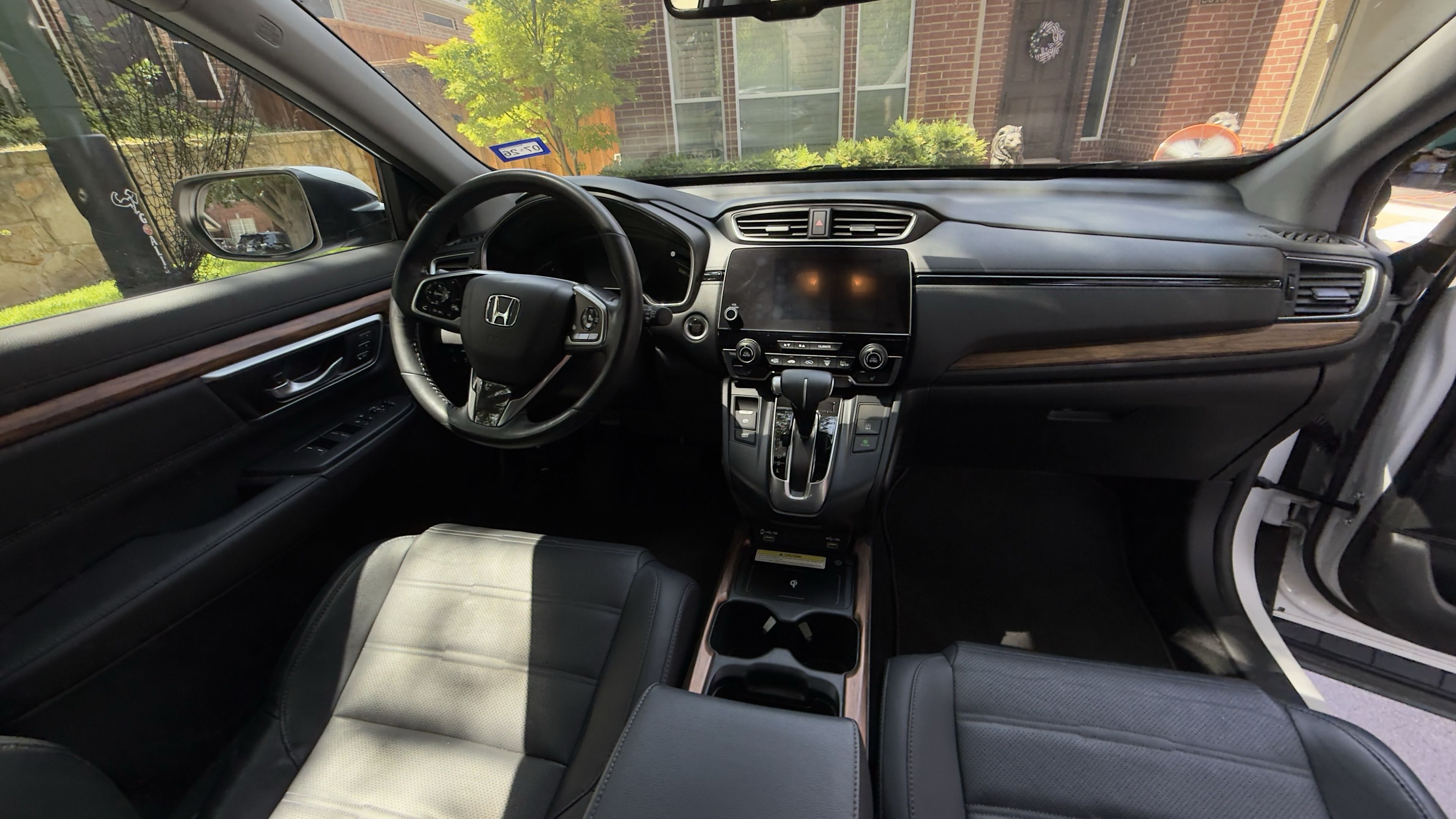 Clean dashboard and center console with wood-grain trim