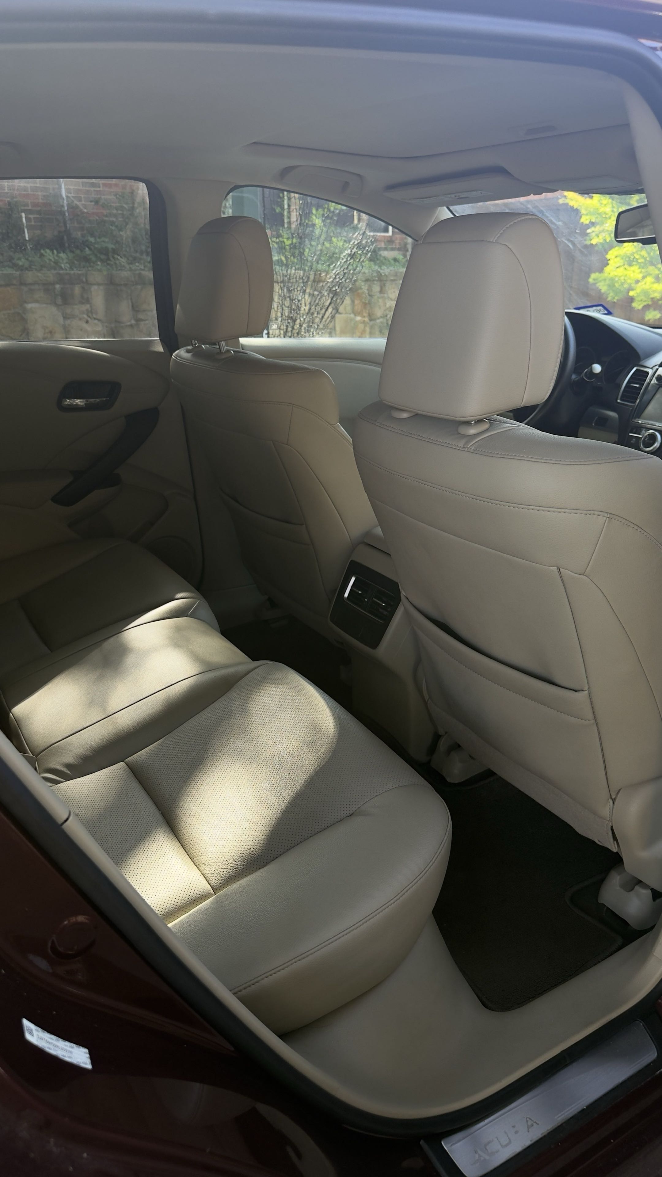 Clean tan leather rear seats